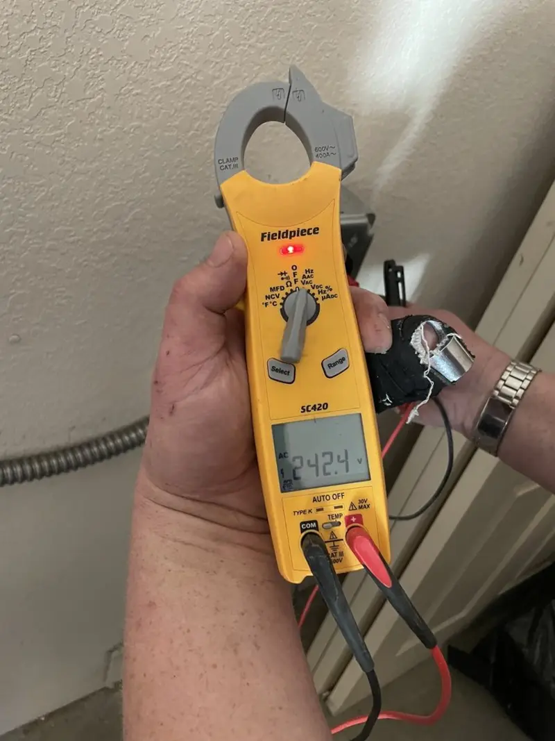 Voltage testing with clamp meter during Recessed Lighting Installation in Anderson Creek
